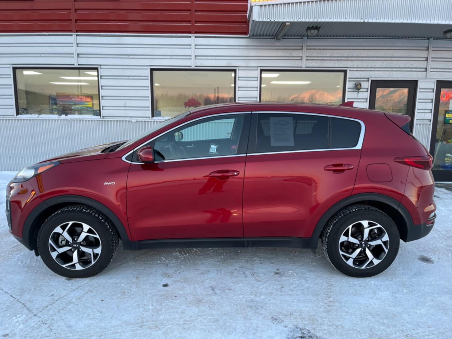 2021 Red /black Kia Sportage LX AWD (KNDPMCAC8M7) with an 2.4L V6 DOHC 24V engine, 6A transmission, located at 1960 Industrial Drive, Wasilla, 99654, (907) 274-2277, 61.573475, -149.400146 - Photo#2